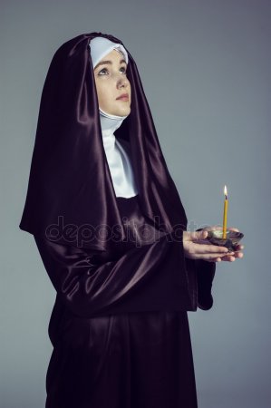 depositphotos_95264512-stock-photo-nun-with-candle.jpg